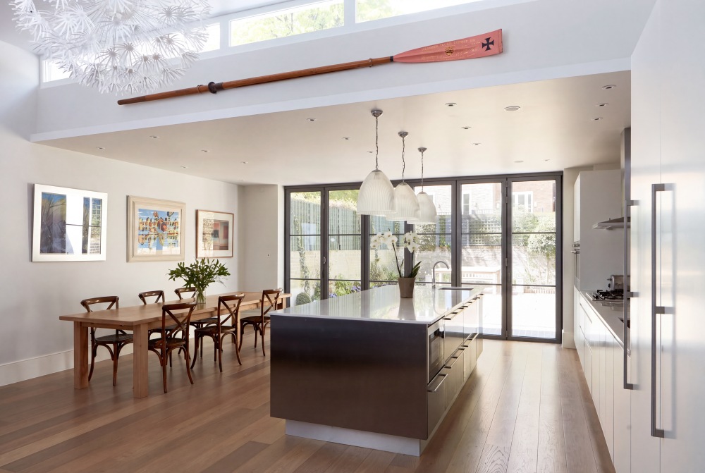 Notting Hill House — Kitchen and Dining Top-lit kitchen and dining extension by FT Architects with stainless island and Crittall doors opening to the garden in Notting Hill