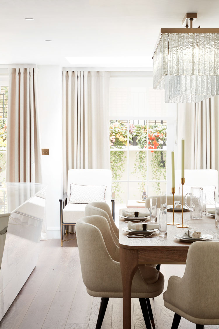 ft-architects-ovington-square-dining Neutral dining space with dressed table and glass chandelier overlooking a planted garden window