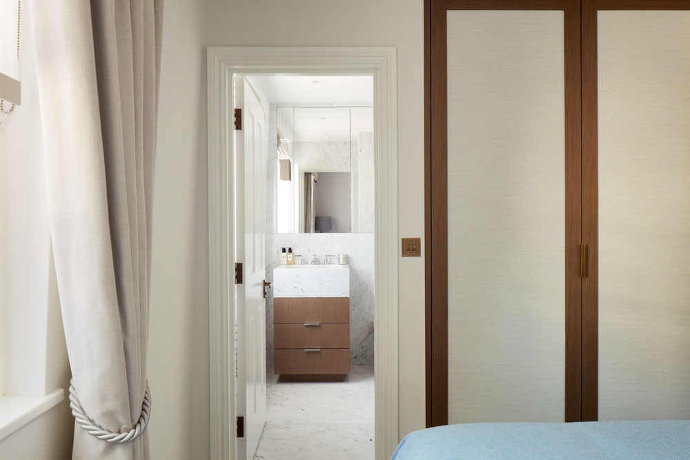 ft-architects-ovington-square-ensuite View from the bedroom through to a marble en suite with timber vanity