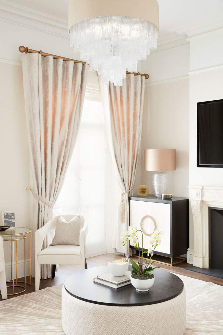 ft-architects-ovington-square-sitting-room Refined sitting room with champagne velvet curtains, glass chandelier and marble fireplace